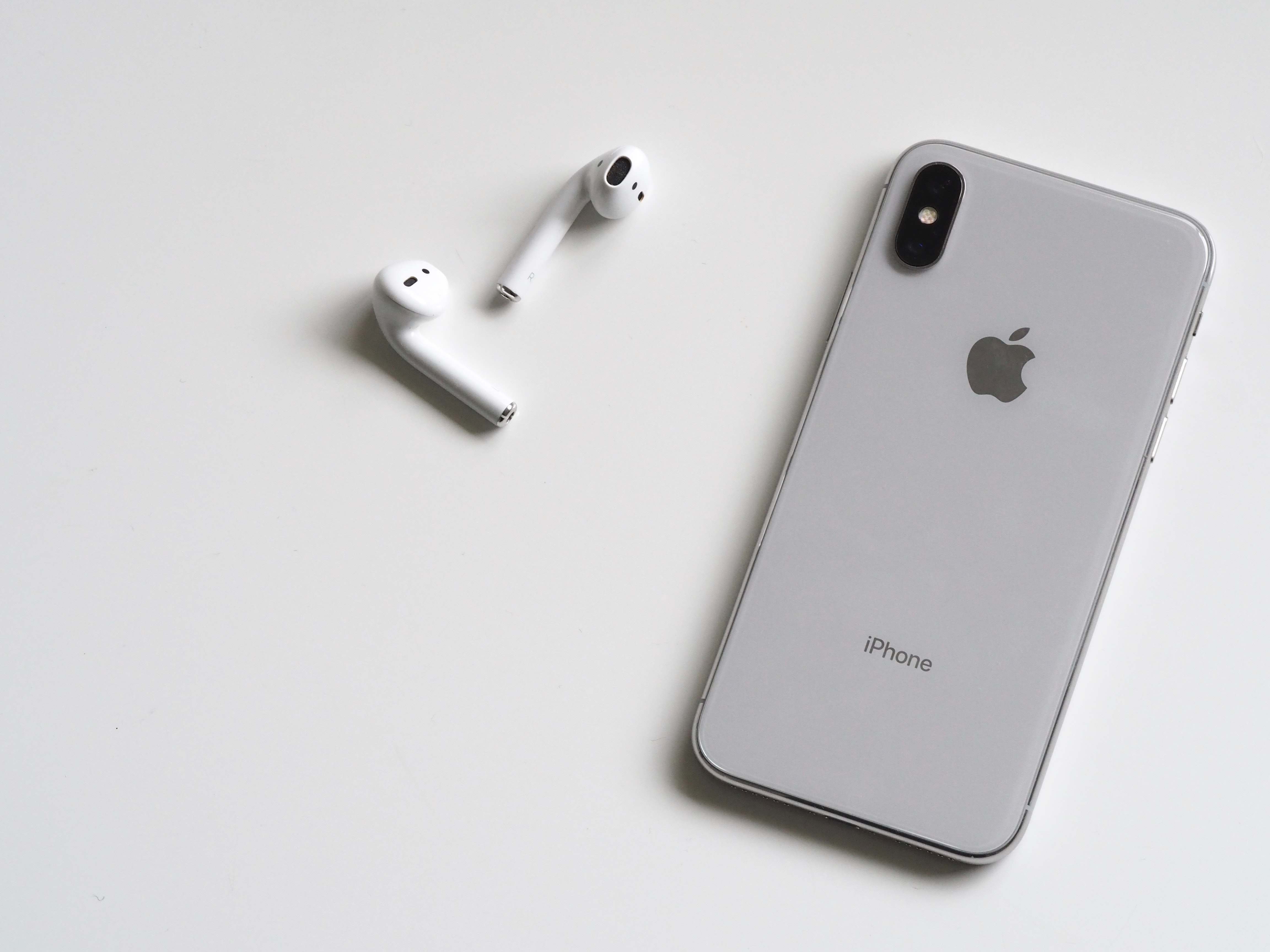 Silver iphone x with airpods 788946